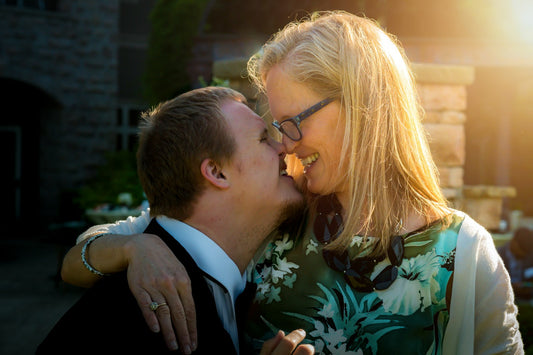 Mother embracing her son on his wedding day before their dance