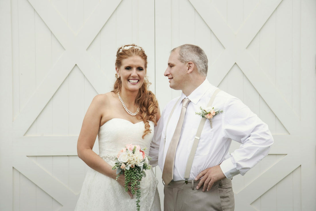 Father and bride smiling together before their father-daughter wedding dance