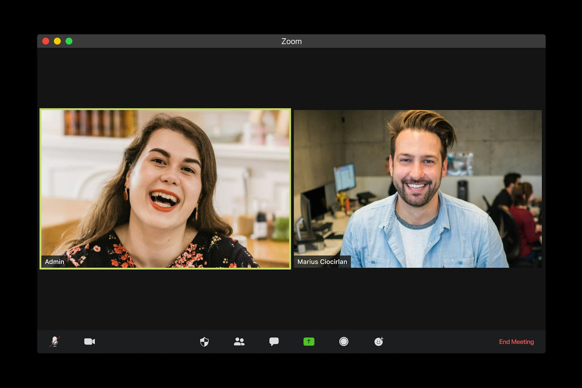 Long-distance couple smiling at each other on a video call