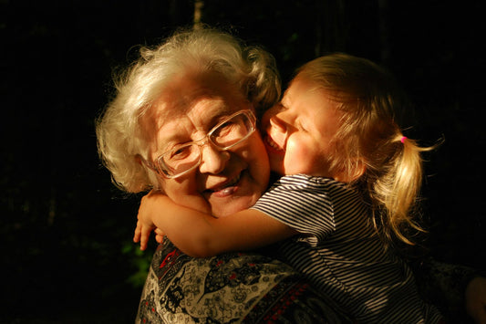 Grandmother hugging her granddaughter