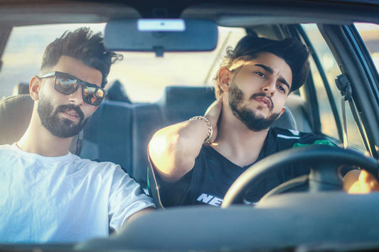 Best friends singing along to their favorite songs together in the car