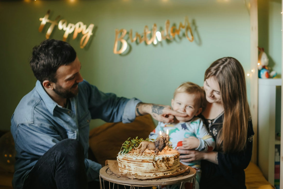 Dad smiling as his family celebrates his 60th birthday together