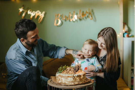 Dad smiling as his family celebrates his 60th birthday together